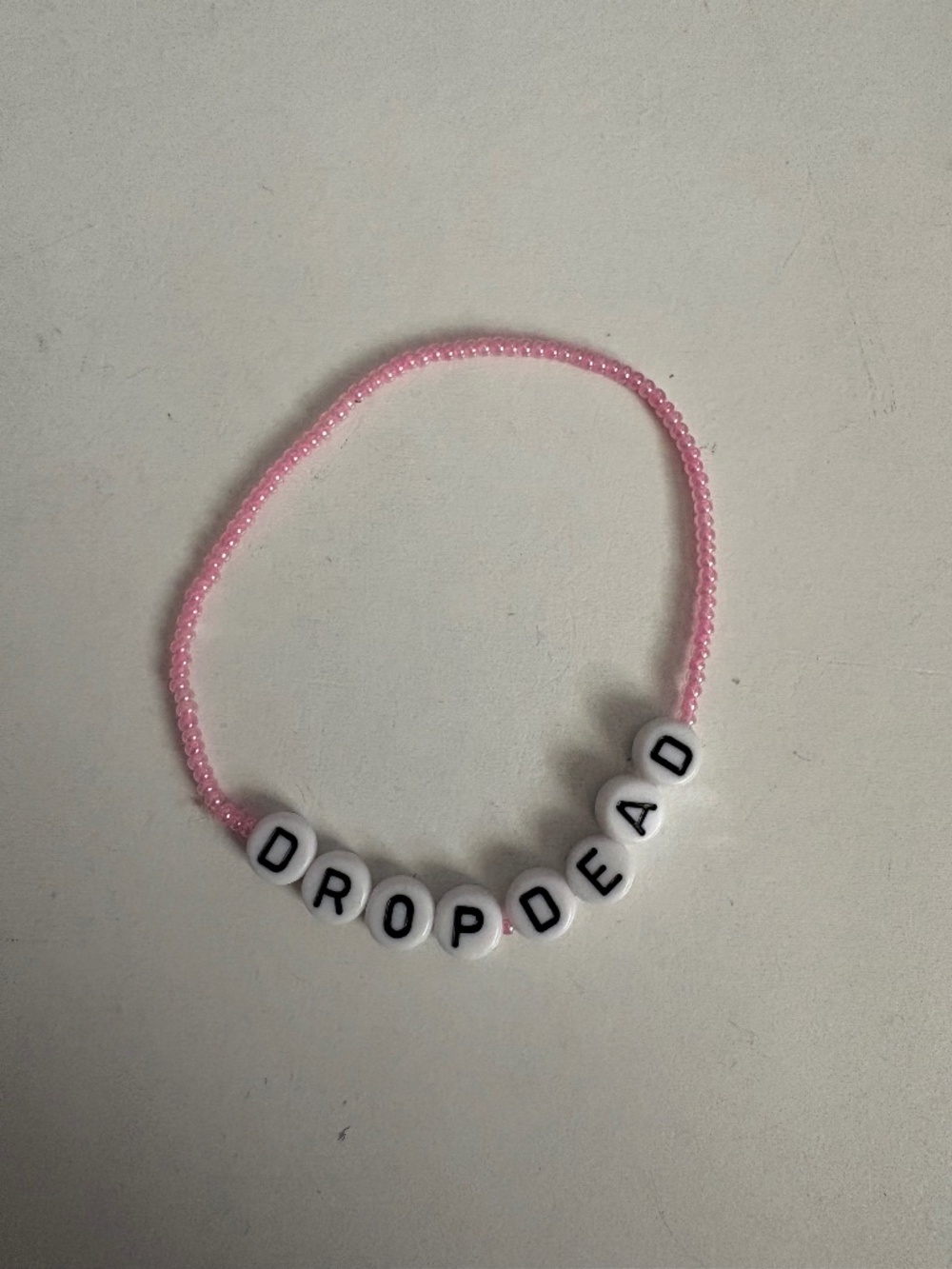 Olivia Rodrigo “drop dead” bracelet